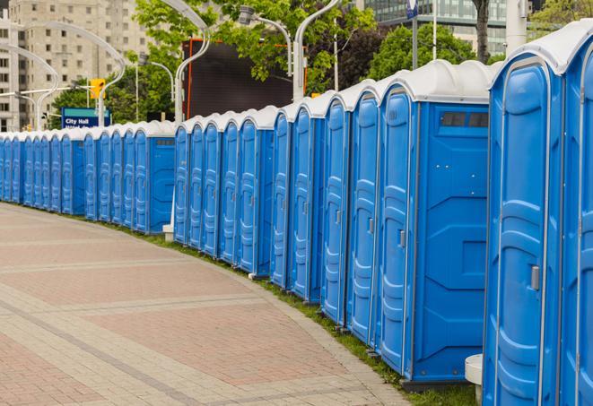 a row of portable restrooms at a fairground, offering visitors a clean and hassle-free experience in canjilon